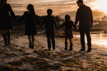 Family walk at sunset